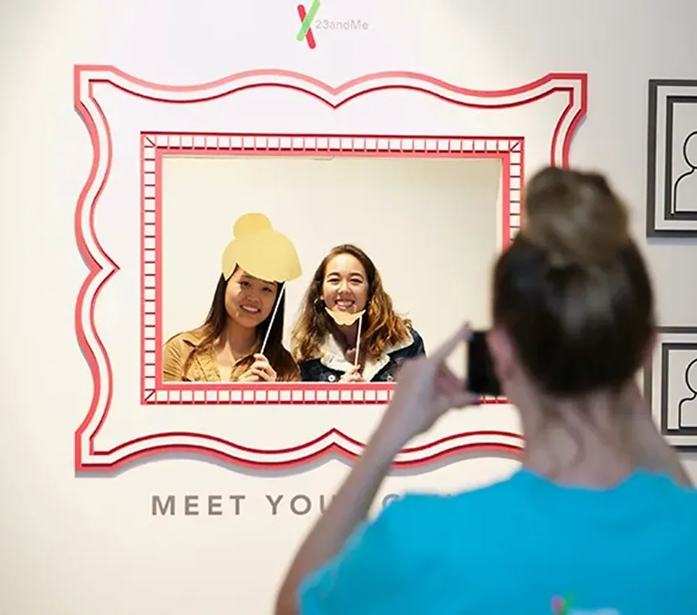 Guests pose for a photo within an oversized picture-frame installation at the “Meet Your Genes” experience. The playful, interactive moment encourages participants to see themselves within the story of their own genetics, blending self-discovery, reflection, and social sharing in a way that feels both personal and engaging.